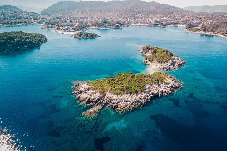 Aerial view of the coastline of the resort town of Ksamil on a sunny summer day. Albania.
