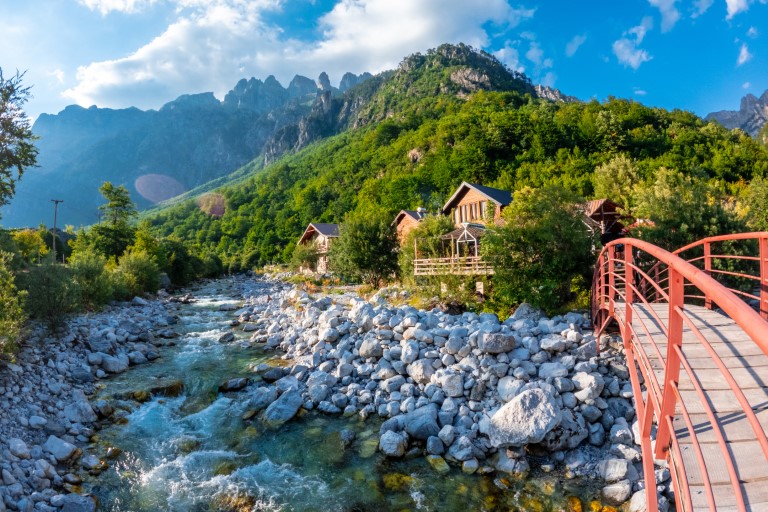 Red bridge along the river of Valbona Valley, Theth National Park, Albanian Alps, Albania